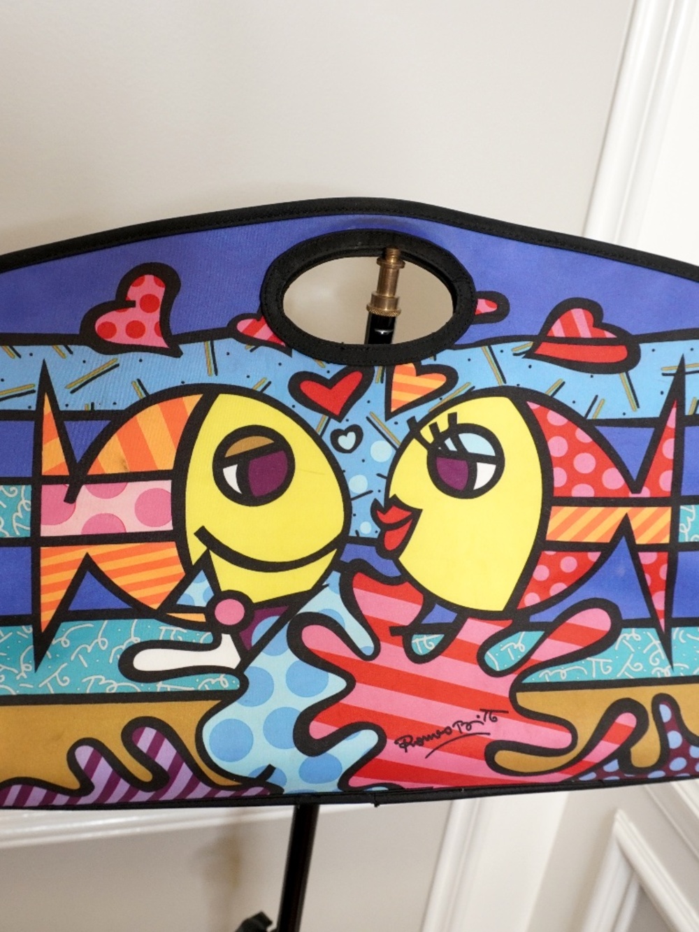 Romero Britto "Deeply in Love" tote bag featuring vibrant pop art of kissing fis